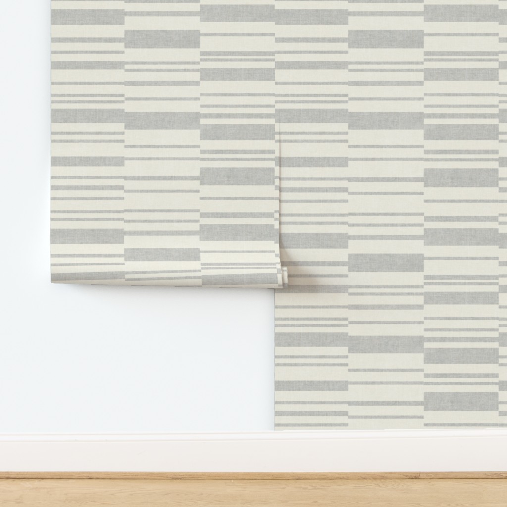 Wallpaper in Textured broken stripes light grey silver and off white